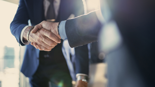 Two men shaking hands and friendly litigation