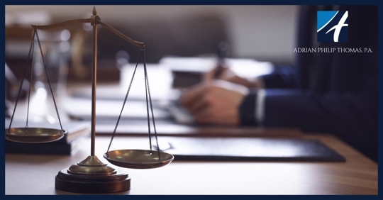 Legal scale with blurred lawyer male hands in bank